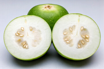 Two Halves of a Green Tinda Indian Apple Gourd Seeds Visible
