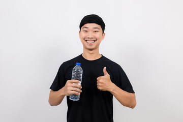 Positive asian man black shirt happy smile hold water bottle and show thumb up isolated