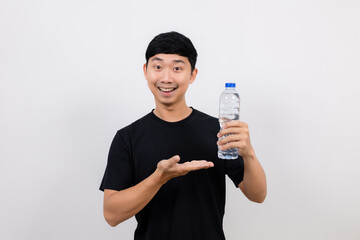 Positive asian man black shirt show water plastic bottle isolated