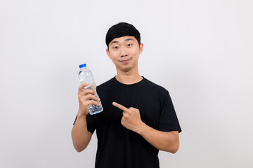 Positive asian man black shirt point finger water plastic bottle in hand isolated