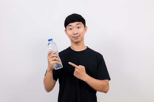 Positive asian man black shirt point finger water plastic bottle in hand isolated