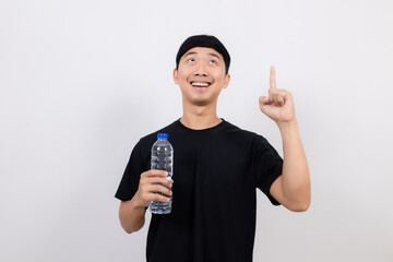 Positive asian man black shirt gesture open water bottle with happy smile point finger up isolated