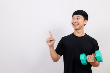 Positive asian man happy smile black shirt work out with dumbbell gesture point finger isolated
