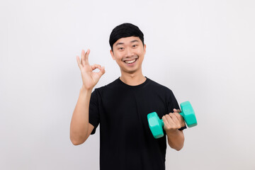 Positive asian man black shirt work out with dumbbell show ok up isolated