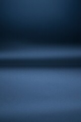 Minimalist dark blue studio background for luxury product display and presentation.