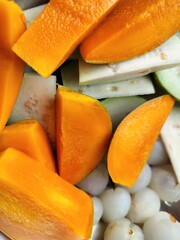 Fresh Raw pieces of fruits Vibrant Mango, Green Guava and White Lichi served for eating at Summer.