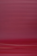  Vibrant abstract background in rich red and magenta tones with fluid motion.