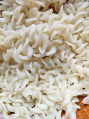 Pasta is a type of food made from dough, typically of wheat flour and water or eggs, formed into various shapes and then cooked by boiling or baking like noodles. Asian Food.