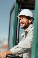 portrait of loader with warm smile positioned on right side of frame