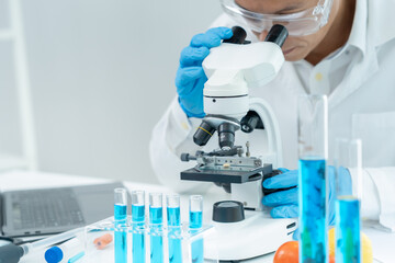 Scientist analyze biochemical samples in advanced scientific laboratory. Medical professional use...