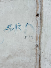 A wall with graffiti on it