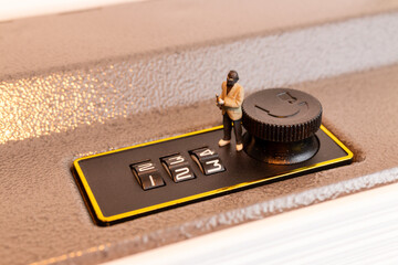 Miniature Thief Cracking Safe Lock Combination
