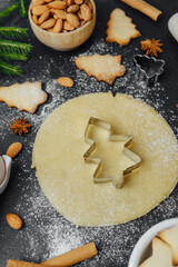 Christmas baking flatlay with cookies, spices, dough and eggs for holiday culinary concept