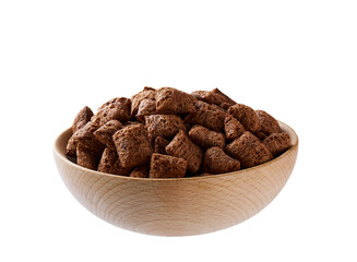 wooden bowl of tasty chocolate corn pads isolated on a white background.