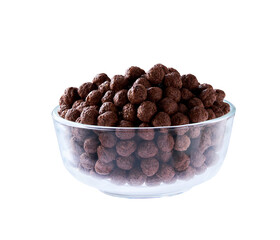 chocolate corn balls in a clear glass bowl isolated on a white background