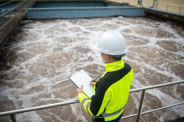 A wastewater treatment engineer is inspecting the operation of a water treatment plant