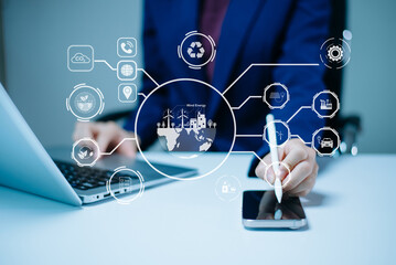 Woman using futuristic interface with smart tech and mobile to manage ESG, clean energy, and sustainability data.