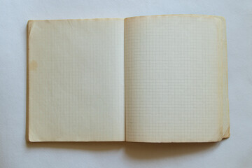 Notebook in a cage old fastened with staples, educational background for school and education