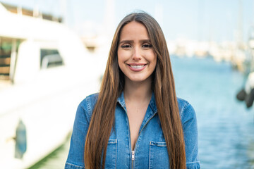 Young woman at outdoors With happy expression