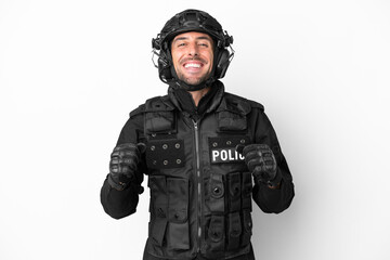 SWAT caucasian man isolated on white background celebrating a victory in winner position