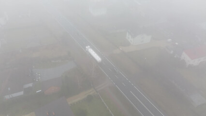 Overhead view rural road covered in fog