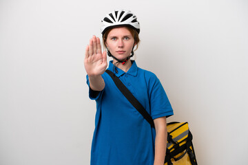 Young English woman with thermal backpack isolated on white background making stop gesture