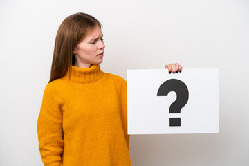 Young English woman isolated on white background holding a placard with question mark symbol