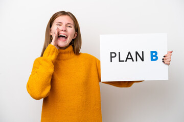 Young English woman isolated on white background holding a placard with the message PLAN B and...