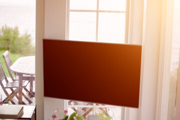 Elegant living room with TV and nature view