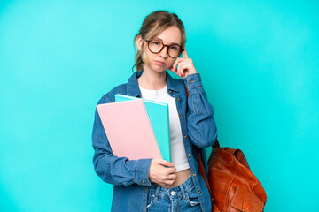 Young student woman isolated on blue background thinking an idea