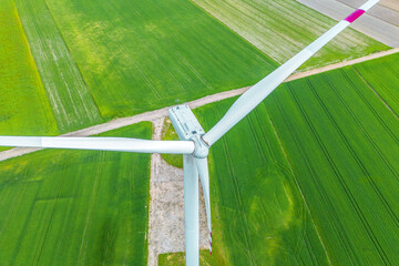Clean energy windmill on rural plantation field