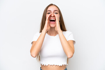 Young caucasian woman isolated on white background shouting and announcing something