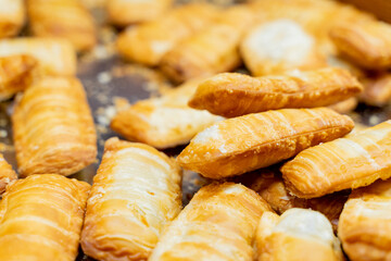 A deliciously crispy golden taro cake freshly fried and served at a bustling night market. The snack features a crunchy exterior with a soft, flavorful taro filling, capturing the authentic taste of t
