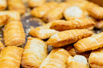A deliciously crispy golden taro cake freshly fried and served at a bustling night market. The snack features a crunchy exterior with a soft, flavorful taro filling, capturing the authentic taste of t