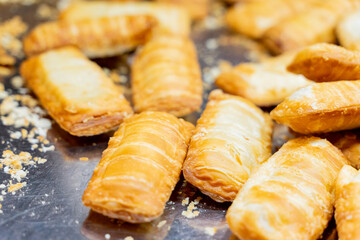 A deliciously crispy golden taro cake freshly fried and served at a bustling night market. The snack features a crunchy exterior with a soft, flavorful taro filling, capturing the authentic taste of t