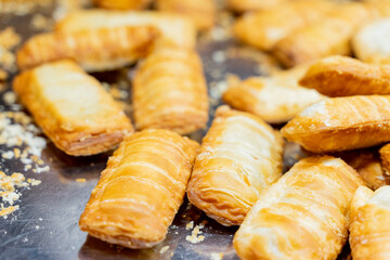 A deliciously crispy golden taro cake freshly fried and served at a bustling night market. The...