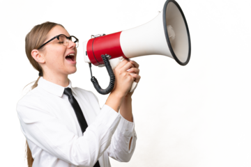 Young business caucasian woman over isolated background shouting through a megaphone