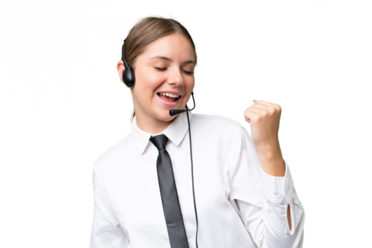 Telemarketer caucasian woman working with a headset over isolated background celebrating a victory