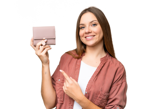 Young blonde woman holding a wallet over isolated chroma key background and pointing it