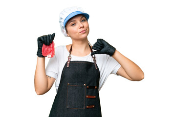 Butcher woman wearing an apron and serving fresh cut meat over isolated chroma key background proud and self-satisfied