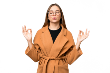 Young blonde woman over isolated chroma key background in zen pose