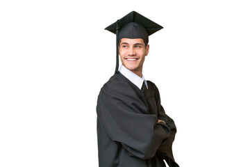 Young university graduate caucasian man over isolated background with arms crossed and happy