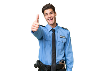 Young police man over isolated background with thumbs up because something good has happened