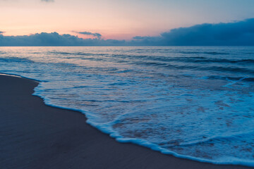 Calm Mediterranean Seascape during the blue hour off the coast of France near the city of Marseillan. Moments before sunrise