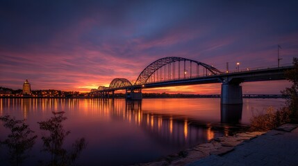 Centennial Bridge across the Mississippi River at dusk between Rock Island, Illinois and Davenport, Iowa.