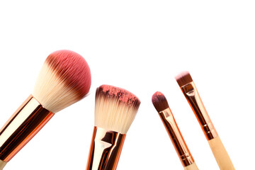 Rose Gold Makeup Brushes Set with Pink Blush Powder on Bristles Isolated on a transparent background
