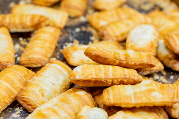 A deliciously crispy golden taro cake freshly fried and served at a bustling night market. The...