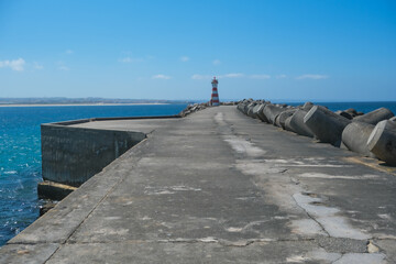 Jetty with a lighthouse. Peniche pier in Portugal	