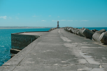 Jetty with a lighthouse. Peniche pier in Portugal	