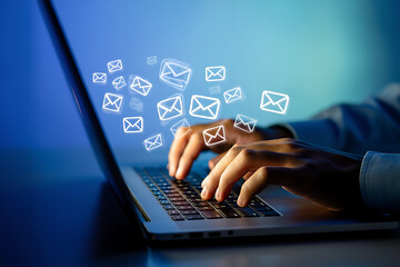 Sending Emails Hands Typing on Laptop with Email Envelopes Floating on Screen, Blue Background